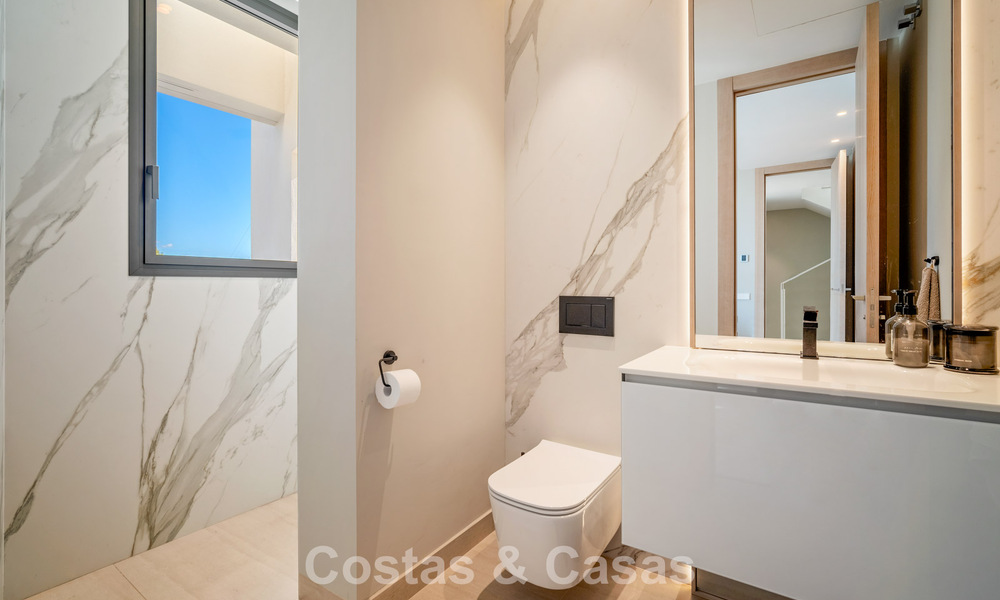 Minimalist luxury home with panoramic sea views for sale in a prestigious gated complex in Nueva Andalucia, Marbella 788614