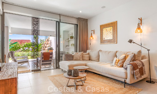 Ground-floor, modern apartment with large private garden, terrace and partial sea views for sale on golf course in Estepona 789780 