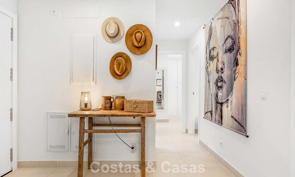 Ground-floor, modern apartment with large private garden, terrace and partial sea views for sale on golf course in Estepona 789783