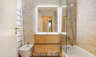 Ground-floor, modern apartment with large private garden, terrace and partial sea views for sale on golf course in Estepona 789784 