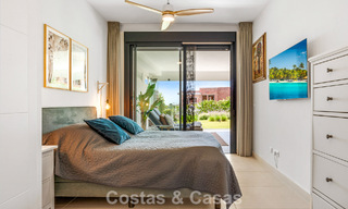 Ground-floor, modern apartment with large private garden, terrace and partial sea views for sale on golf course in Estepona 789787 