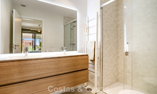 Ground-floor, modern apartment with large private garden, terrace and partial sea views for sale on golf course in Estepona 789789 