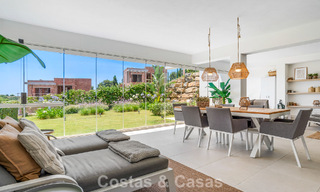 Ground-floor, modern apartment with large private garden, terrace and partial sea views for sale on golf course in Estepona 789791 
