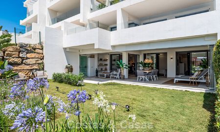 Ground-floor, modern apartment with large private garden, terrace and partial sea views for sale on golf course in Estepona 789794