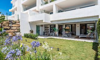 Ground-floor, modern apartment with large private garden, terrace and partial sea views for sale on golf course in Estepona 789794 