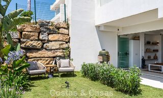 Ground-floor, modern apartment with large private garden, terrace and partial sea views for sale on golf course in Estepona 789795 