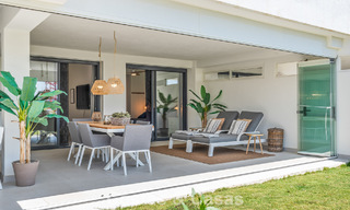 Ground-floor, modern apartment with large private garden, terrace and partial sea views for sale on golf course in Estepona 789798 