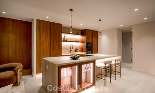 Andalusian-style duplex penthouse with a contemporary interior for sale in Nueva Andalucia, Marbella 789802 