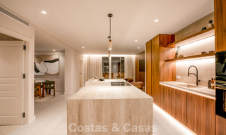 Andalusian-style duplex penthouse with a contemporary interior for sale in Nueva Andalucia, Marbella 789804 