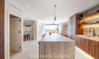 Andalusian-style duplex penthouse with a contemporary interior for sale in Nueva Andalucia, Marbella 789806 