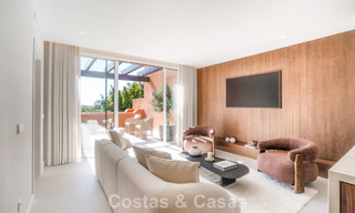 Andalusian-style duplex penthouse with a contemporary interior for sale in Nueva Andalucia, Marbella 789807 