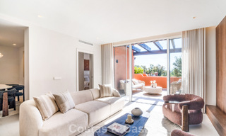 Andalusian-style duplex penthouse with a contemporary interior for sale in Nueva Andalucia, Marbella 789808 