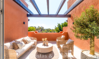 Andalusian-style duplex penthouse with a contemporary interior for sale in Nueva Andalucia, Marbella 789809 
