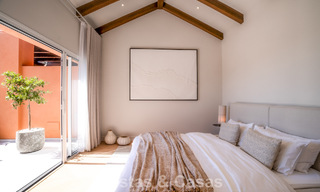 Andalusian-style duplex penthouse with a contemporary interior for sale in Nueva Andalucia, Marbella 789813 