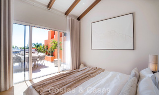 Andalusian-style duplex penthouse with a contemporary interior for sale in Nueva Andalucia, Marbella 789814 