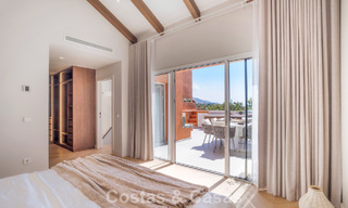 Andalusian-style duplex penthouse with a contemporary interior for sale in Nueva Andalucia, Marbella 789815 