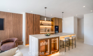 Andalusian-style duplex penthouse with a contemporary interior for sale in Nueva Andalucia, Marbella 789816 