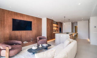 Andalusian-style duplex penthouse with a contemporary interior for sale in Nueva Andalucia, Marbella 789818 
