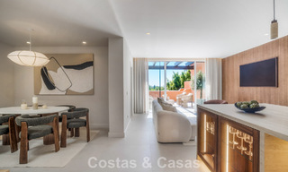 Andalusian-style duplex penthouse with a contemporary interior for sale in Nueva Andalucia, Marbella 789819 