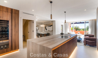 Andalusian-style duplex penthouse with a contemporary interior for sale in Nueva Andalucia, Marbella 789820 