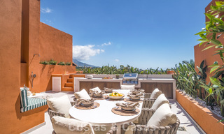 Andalusian-style duplex penthouse with a contemporary interior for sale in Nueva Andalucia, Marbella 789822 
