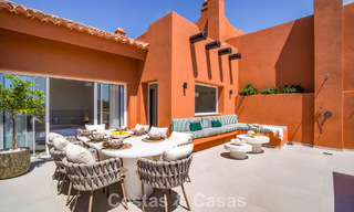 Andalusian-style duplex penthouse with a contemporary interior for sale in Nueva Andalucia, Marbella 789824 
