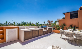 Andalusian-style duplex penthouse with a contemporary interior for sale in Nueva Andalucia, Marbella 789825 
