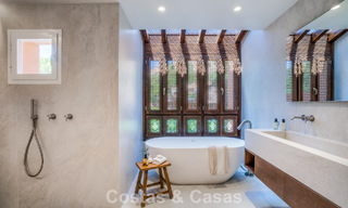 Andalusian-style duplex penthouse with a contemporary interior for sale in Nueva Andalucia, Marbella 789828 