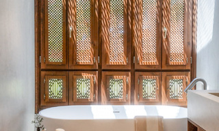 Andalusian-style duplex penthouse with a contemporary interior for sale in Nueva Andalucia, Marbella 789831 