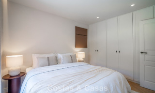 Andalusian-style duplex penthouse with a contemporary interior for sale in Nueva Andalucia, Marbella 789834 