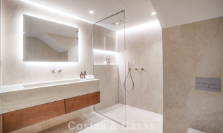 Andalusian-style duplex penthouse with a contemporary interior for sale in Nueva Andalucia, Marbella 789838 