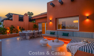 Andalusian-style duplex penthouse with a contemporary interior for sale in Nueva Andalucia, Marbella 789841 