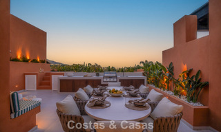 Andalusian-style duplex penthouse with a contemporary interior for sale in Nueva Andalucia, Marbella 789842 