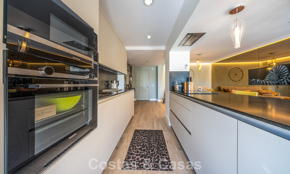 Contemporary renovated apartment for sale in Nueva Andalucía, within walking distance of the beach and Puerto Banús, Marbella 790904