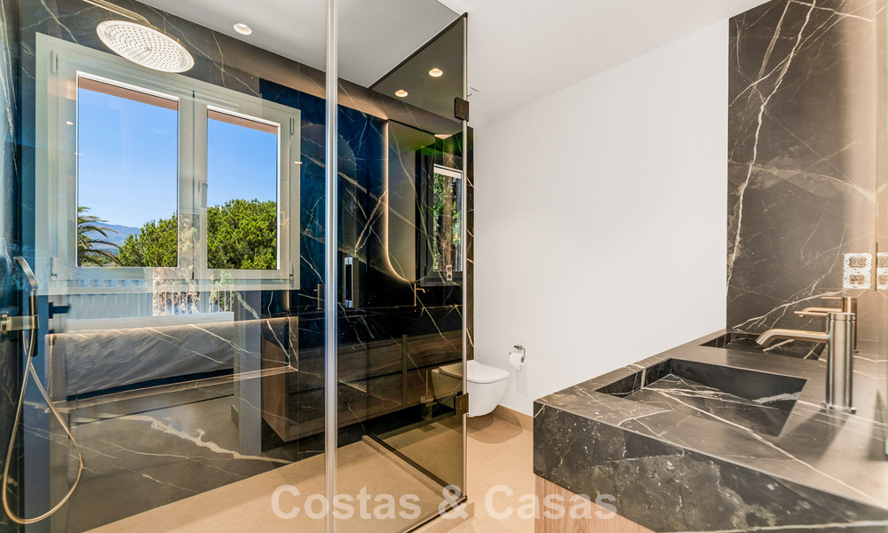 Spacious, contemporary renovated townhouse for sale in a frontline beach complex between Marbella and Estepona 793074