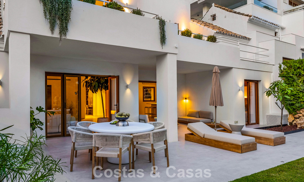 Elegant duplex apartment with private garden for sale, directly on the golf course in Nueva Andalucía, Marbella 793109