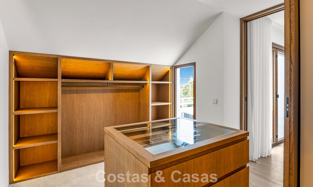 Elegant duplex apartment with private garden for sale, directly on the golf course in Nueva Andalucía, Marbella 793111