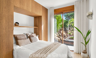 Elegant duplex apartment with private garden for sale, directly on the golf course in Nueva Andalucía, Marbella 793118 