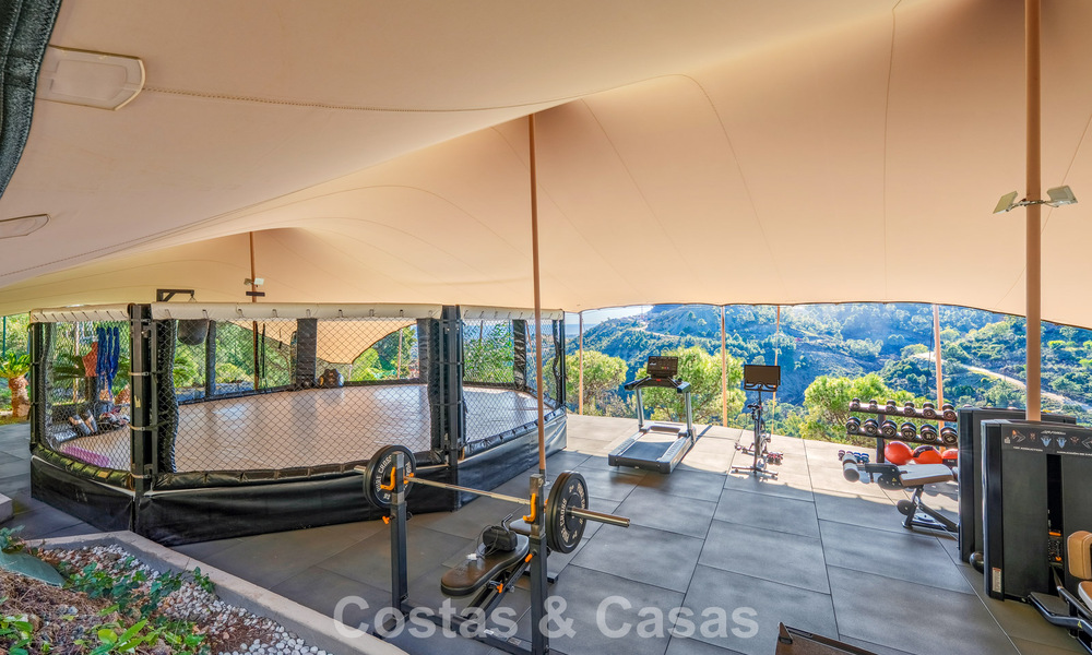 Modern architectural villa with sea views and a profesional gym for sale in El Madroñal, Benahavís - Marbella 793728