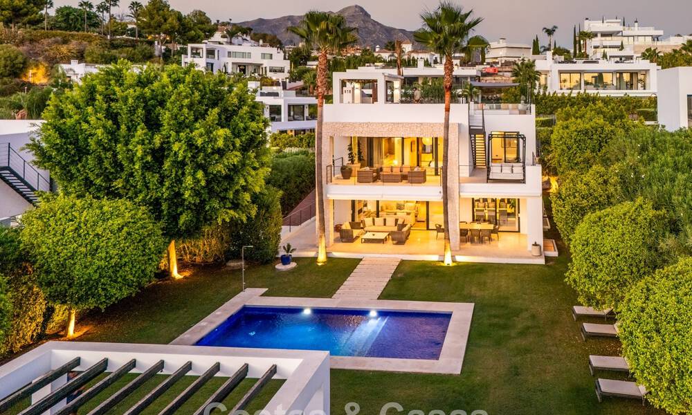 Luxury villa with contemporary architecture for sale in a gated private community of Nueva Andalucía, Marbella 794021