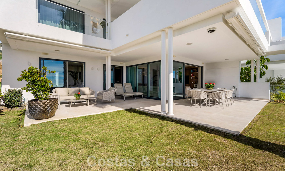 Modern, luxurious garden apartment for sale with panoramic coastal views in a gated boutique complex near Marbella town 794490