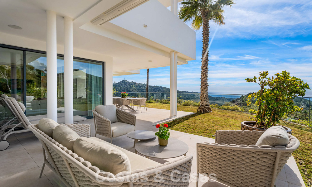 Modern, luxurious garden apartment for sale with panoramic coastal views in a gated boutique complex near Marbella town 794498