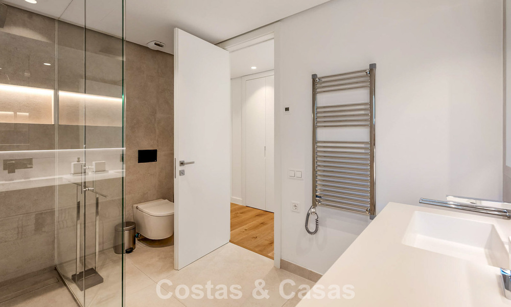 Modern, luxurious garden apartment for sale with panoramic coastal views in a gated boutique complex near Marbella town 794505