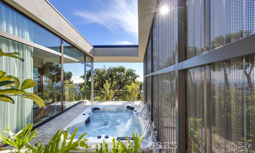 Boomerang-designed villa for sale in the green hills of Marbella - Benahavís with views over the hills and the sea 795262