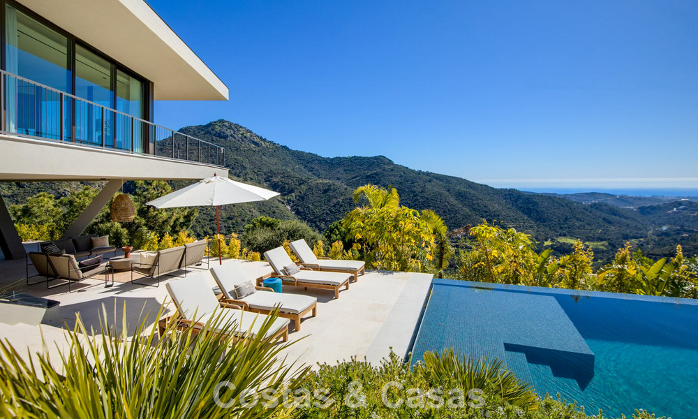 Boomerang-designed villa for sale in the green hills of Marbella - Benahavís with views over the hills and the sea 795276