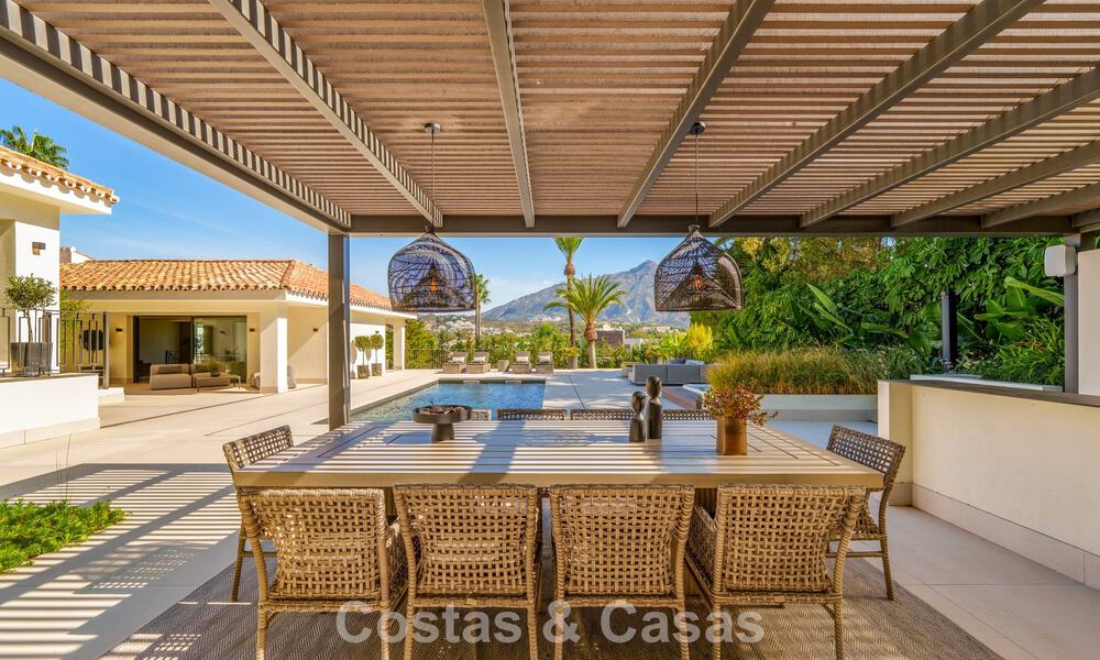 Elegant designer villa with panoramic views for sale over the golf valley of Nueva Andalucía, Marbella 795701