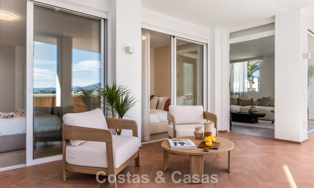 Modern renovated apartment with spacious terrace for sale with panoramic views in Nueva Andalucía, Marbella 796062