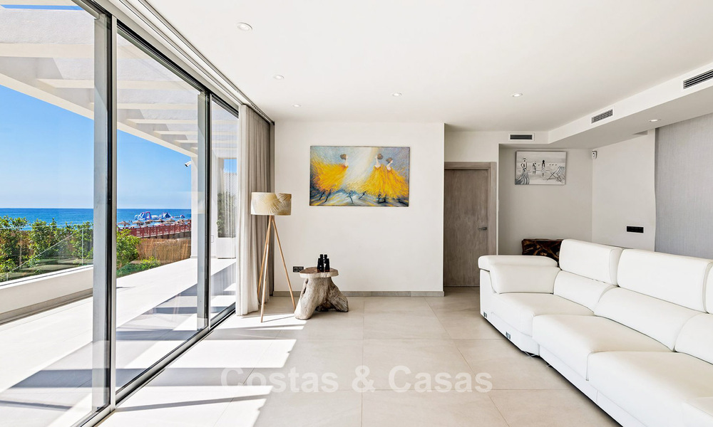 Exclusive, modern beachfront villa for sale with direct access to the beach in Mijas, Costa del Sol 797375