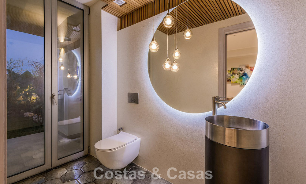 Exclusive, modern beachfront villa for sale with direct access to the beach in Mijas, Costa del Sol 797399