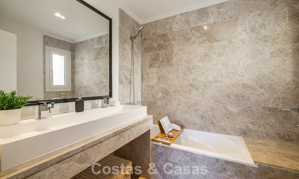 Renovated semi-detached villa for sale with sea view on the golf course east of Marbella 800247